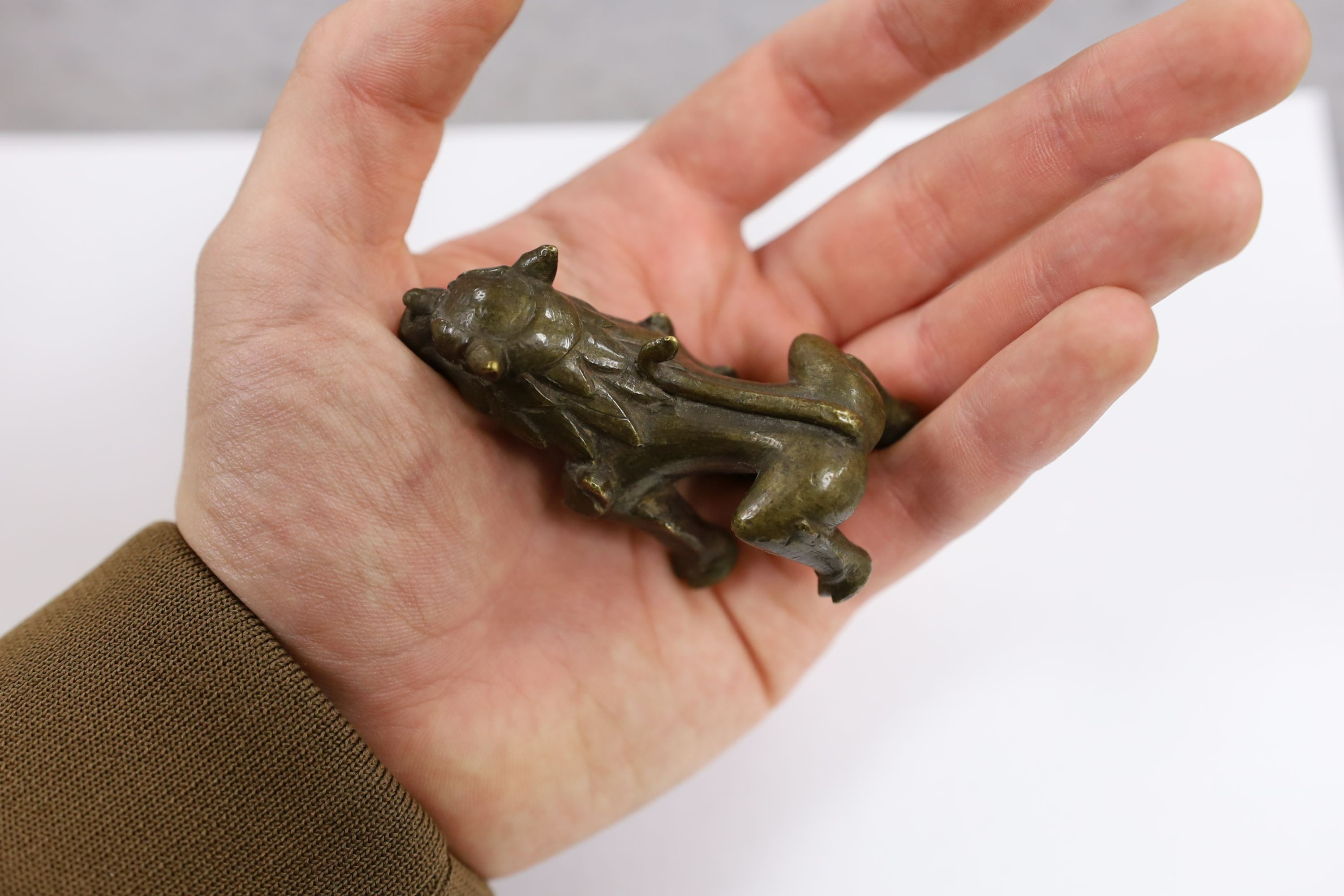 Five Chinese or Tibetan bronze figures or Buddhist implements, tallest 13cms high